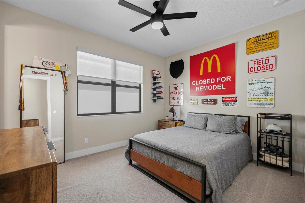 13237 Alton Road Palm Beach Gardens, FL 33418 - Photo 23 of 51 a bedroom with a bed and a window