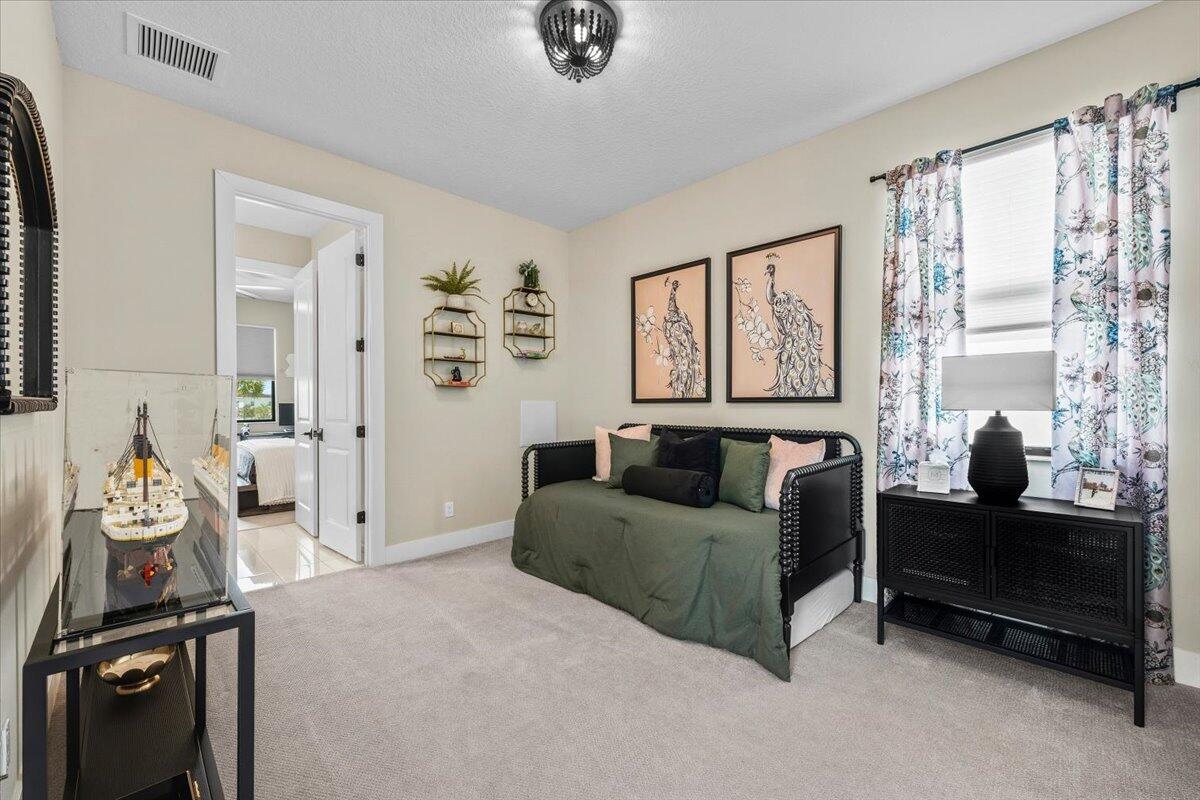 13237 Alton Road Palm Beach Gardens, FL 33418 - Photo 25 of 51 a living room with furniture and a window