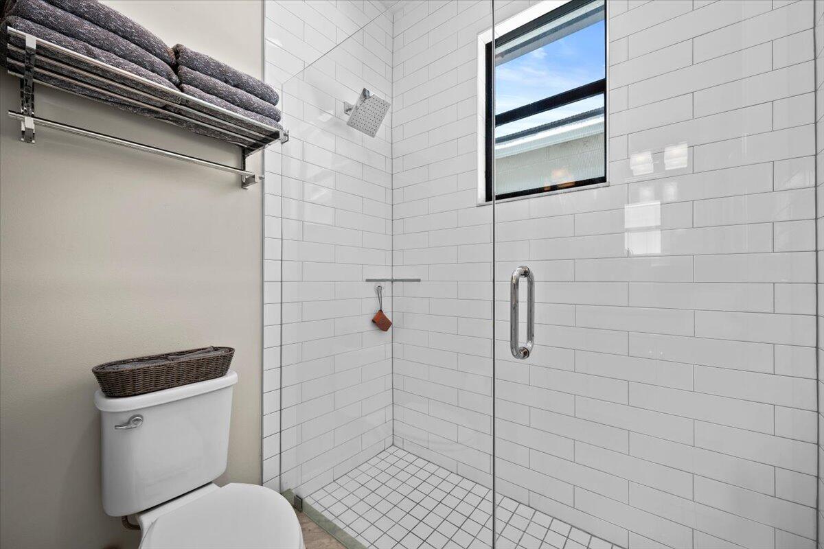 13237 Alton Road Palm Beach Gardens, FL 33418 - Photo 28 of 51 a bathroom with a toilet and a shower