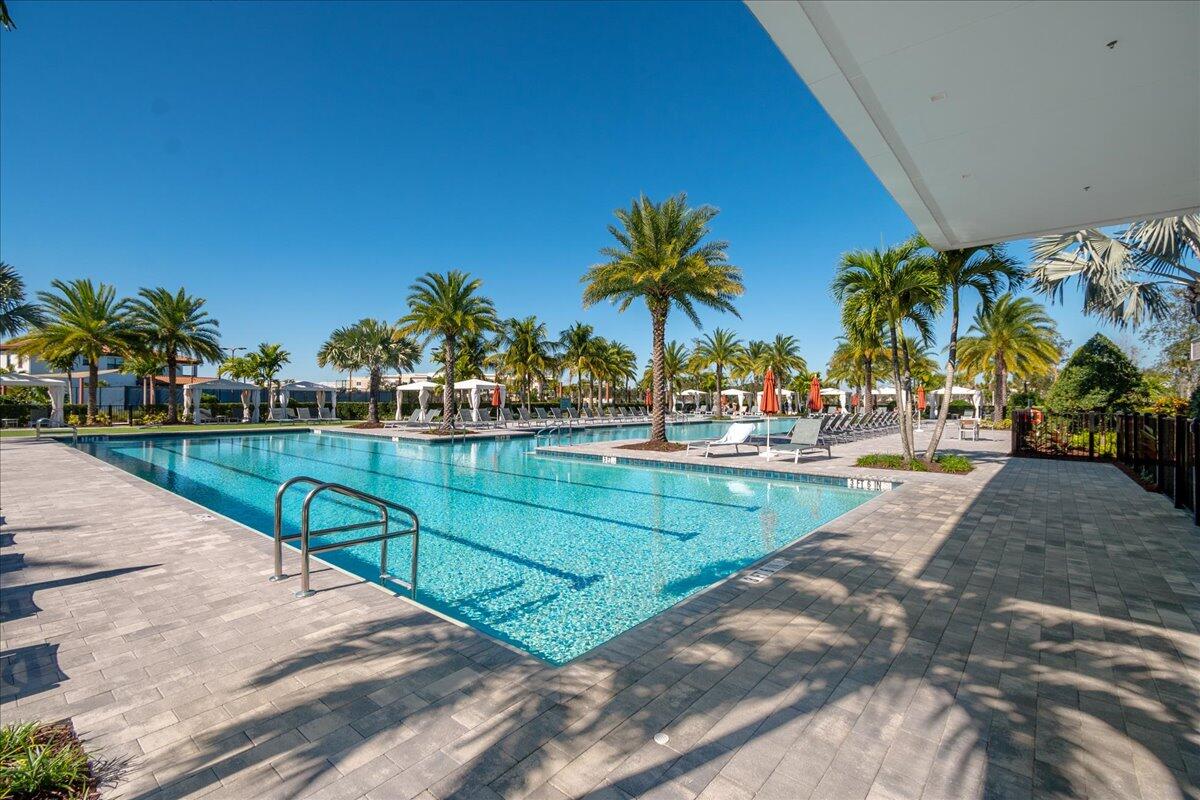13237 Alton Road Palm Beach Gardens, FL 33418 - Photo 41 of 51 a view of a swimming pool with a patio