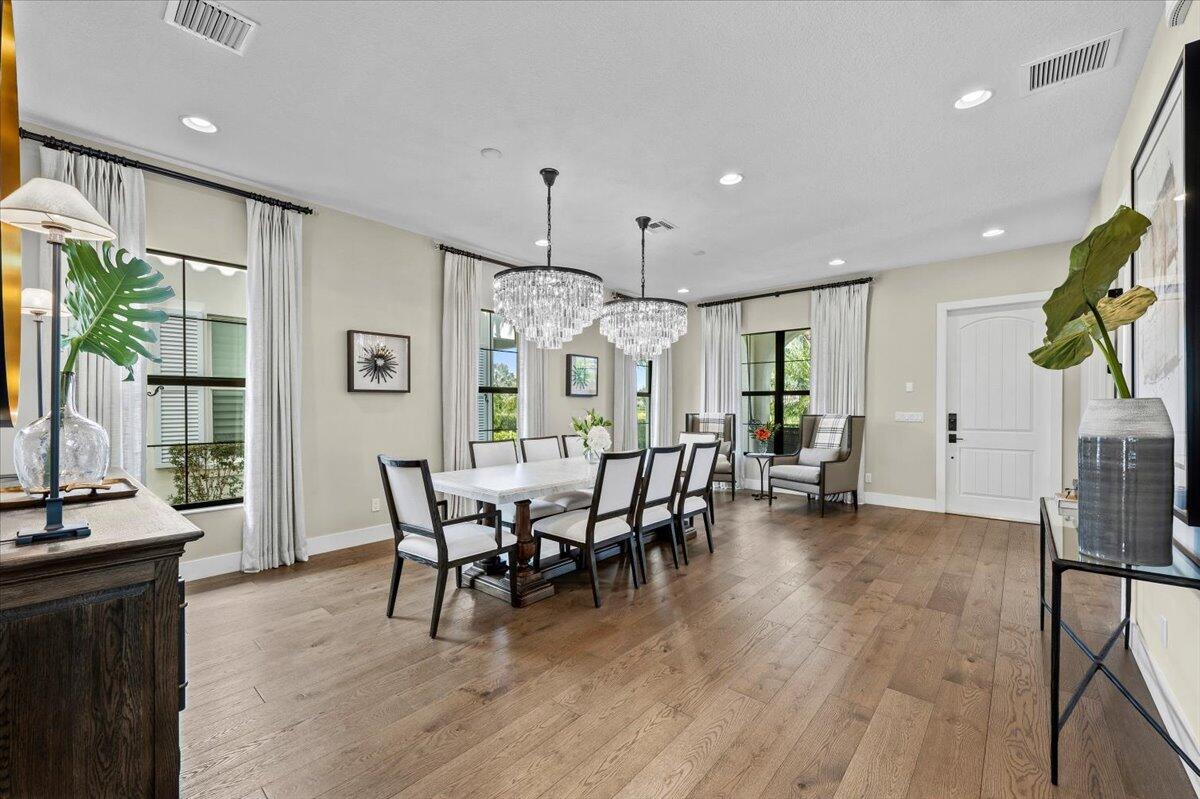 13237 Alton Road Palm Beach Gardens, FL 33418 - Photo 6 of 51 a view of a dining room with furniture window and wooden floor