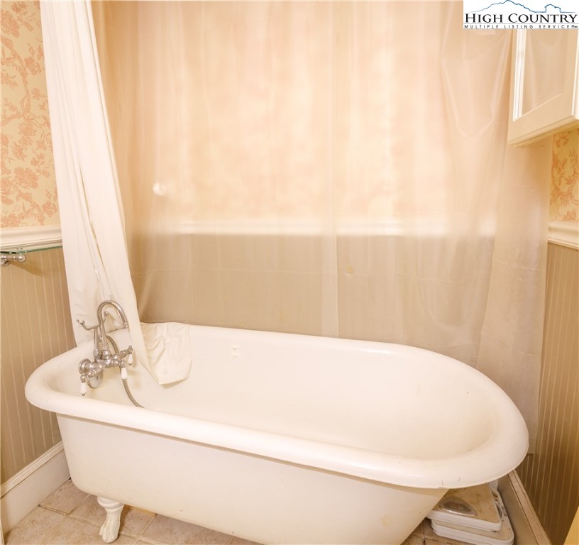5033 Junaluska Road Boone, NC 28607 - Photo 16 of 34 a bathroom with a sink and a mirror