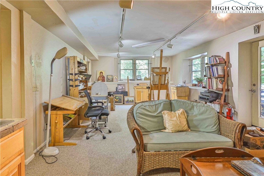 5033 Junaluska Road Boone, NC 28607 - Photo 17 of 34 a view of a livingroom with furniture and a window