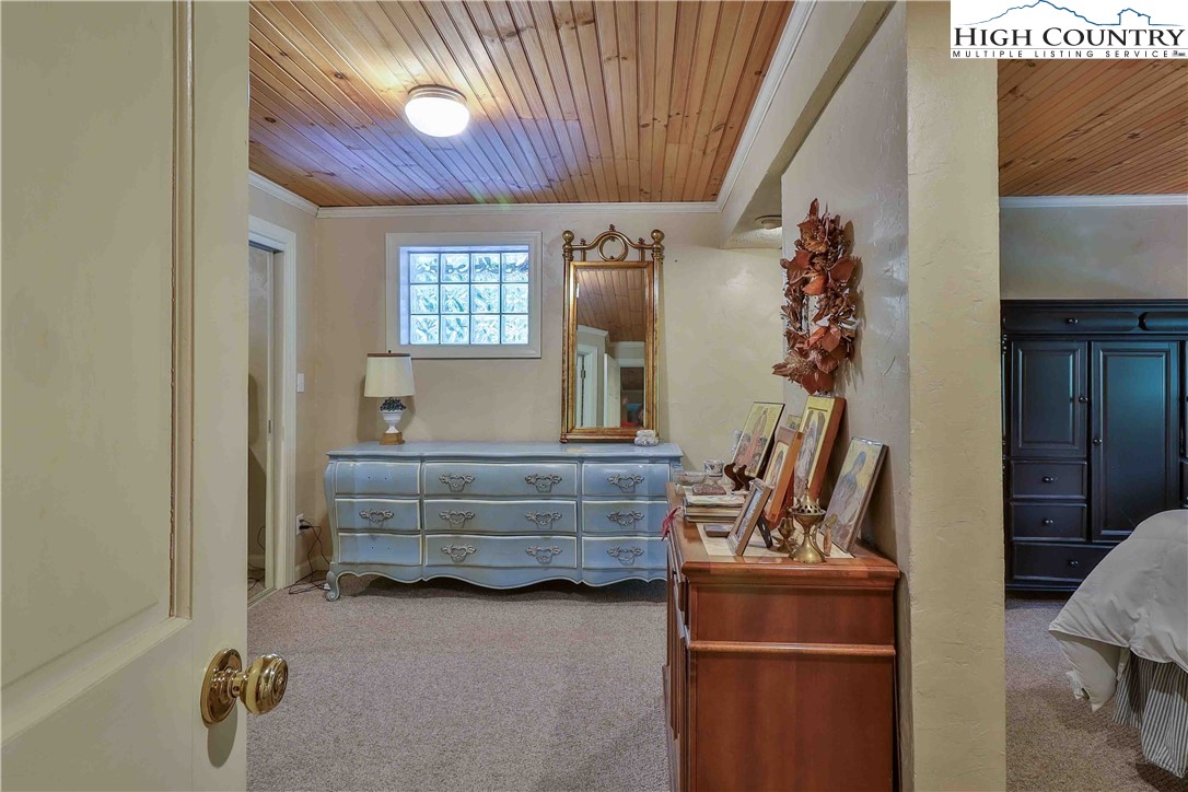 5033 Junaluska Road Boone, NC 28607 - Photo 20 of 34 a room with furniture and window