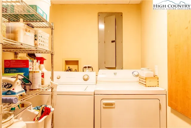 a view of green field with a tree