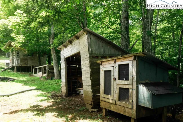 a view of a house with a yard and plants
