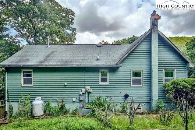 a view of a wooden deck and a yard