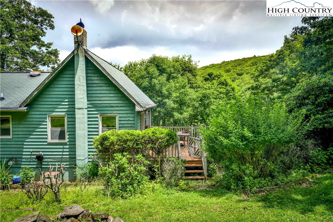 5033 Junaluska Road Boone, NC 28607 - Photo 30 of 34 a view of a house with a yard