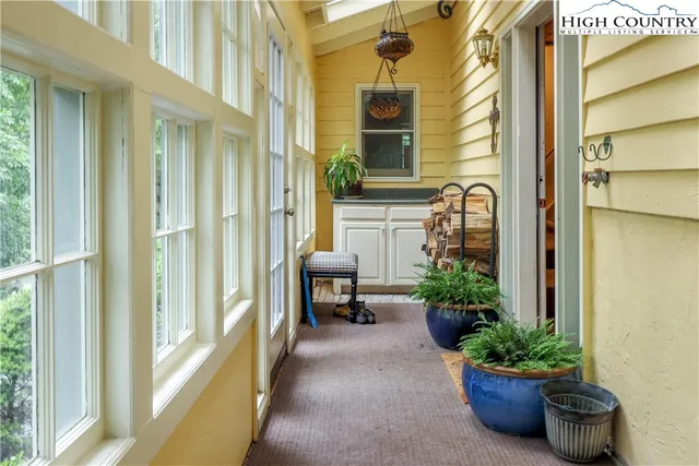 a lobby with furniture and potted plant