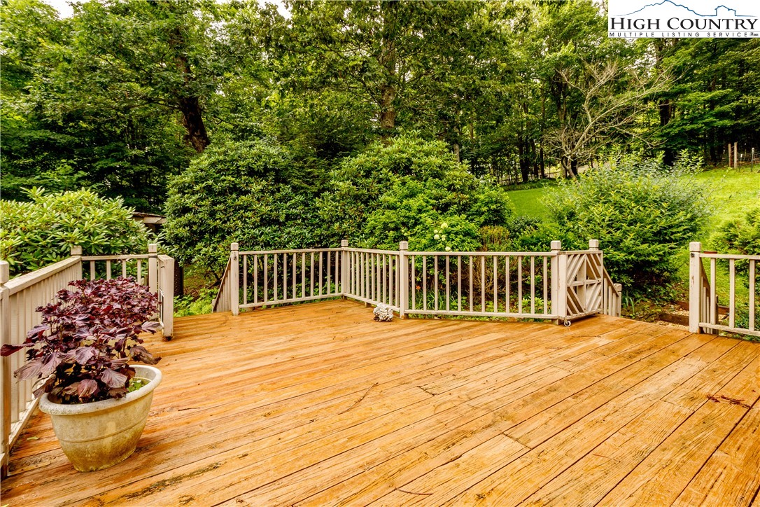 5033 Junaluska Road Boone, NC 28607 - Photo 31 of 34 a view of a wooden deck and a yard