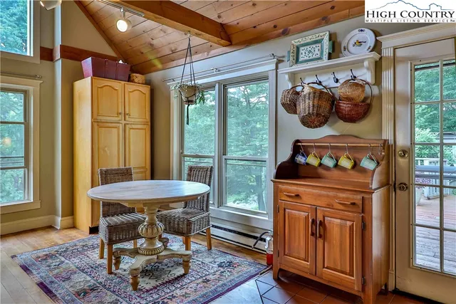 a dining room with a fireplace and a table