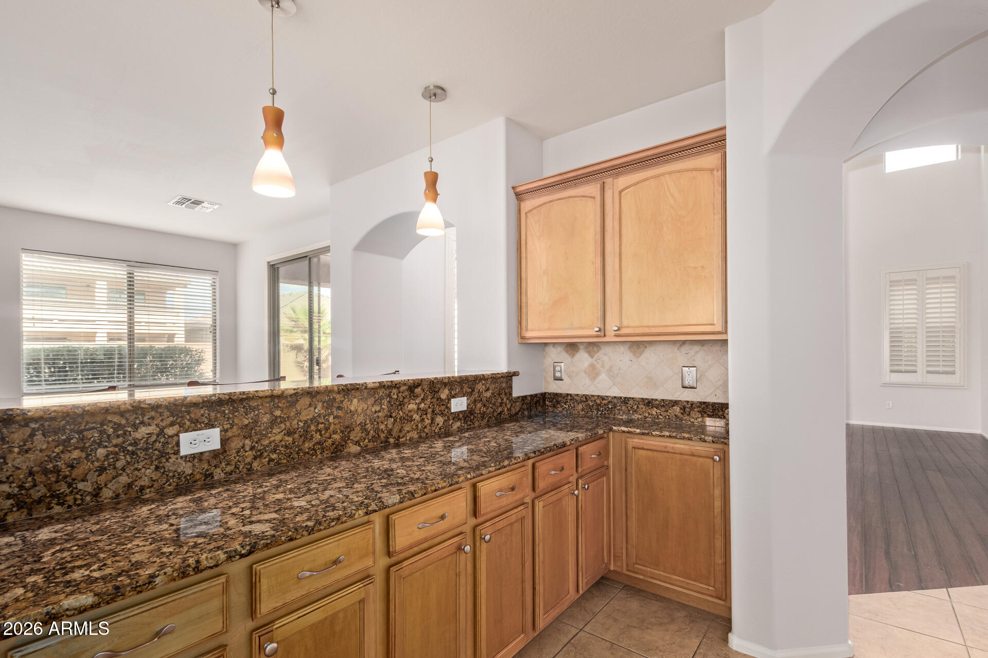 41106 West Coltin Way Maricopa, AZ 85138 - Photo 13 of 51 a view of a granite countertop sink and a window