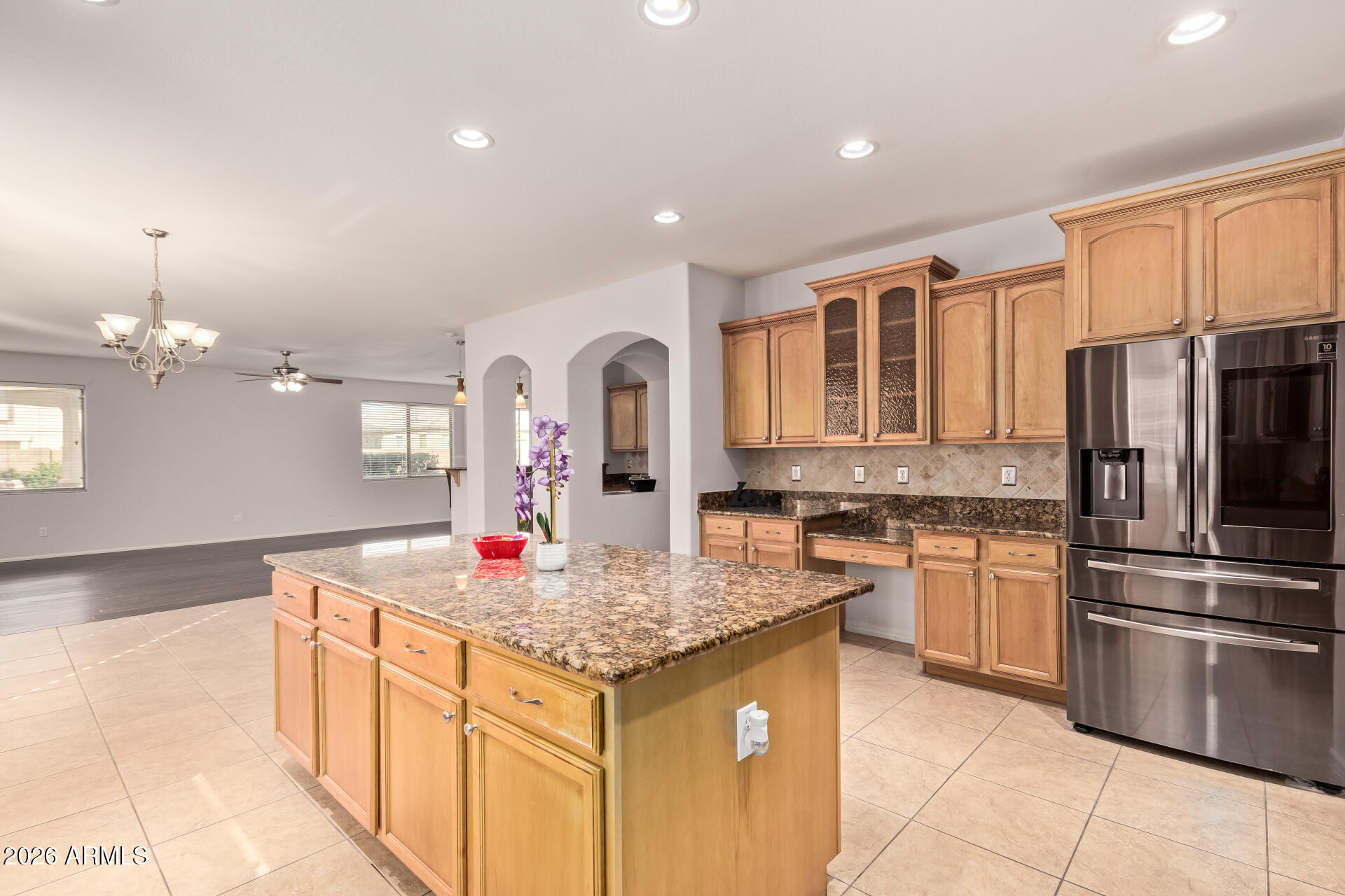41106 West Coltin Way Maricopa, AZ 85138 - Photo 15 of 51 a kitchen with stainless steel appliances granite countertop a sink stove and refrigerator