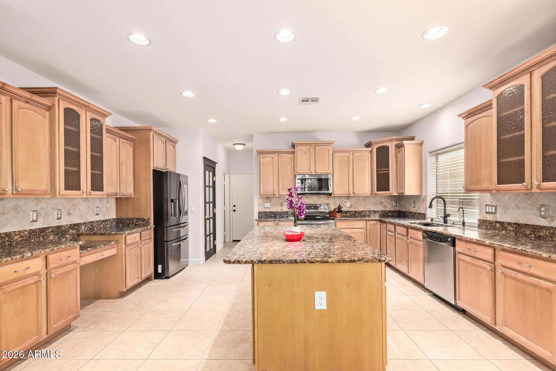 41106 West Coltin Way Maricopa, AZ 85138 - Photo 16 of 51 a kitchen with a sink stove and refrigerator