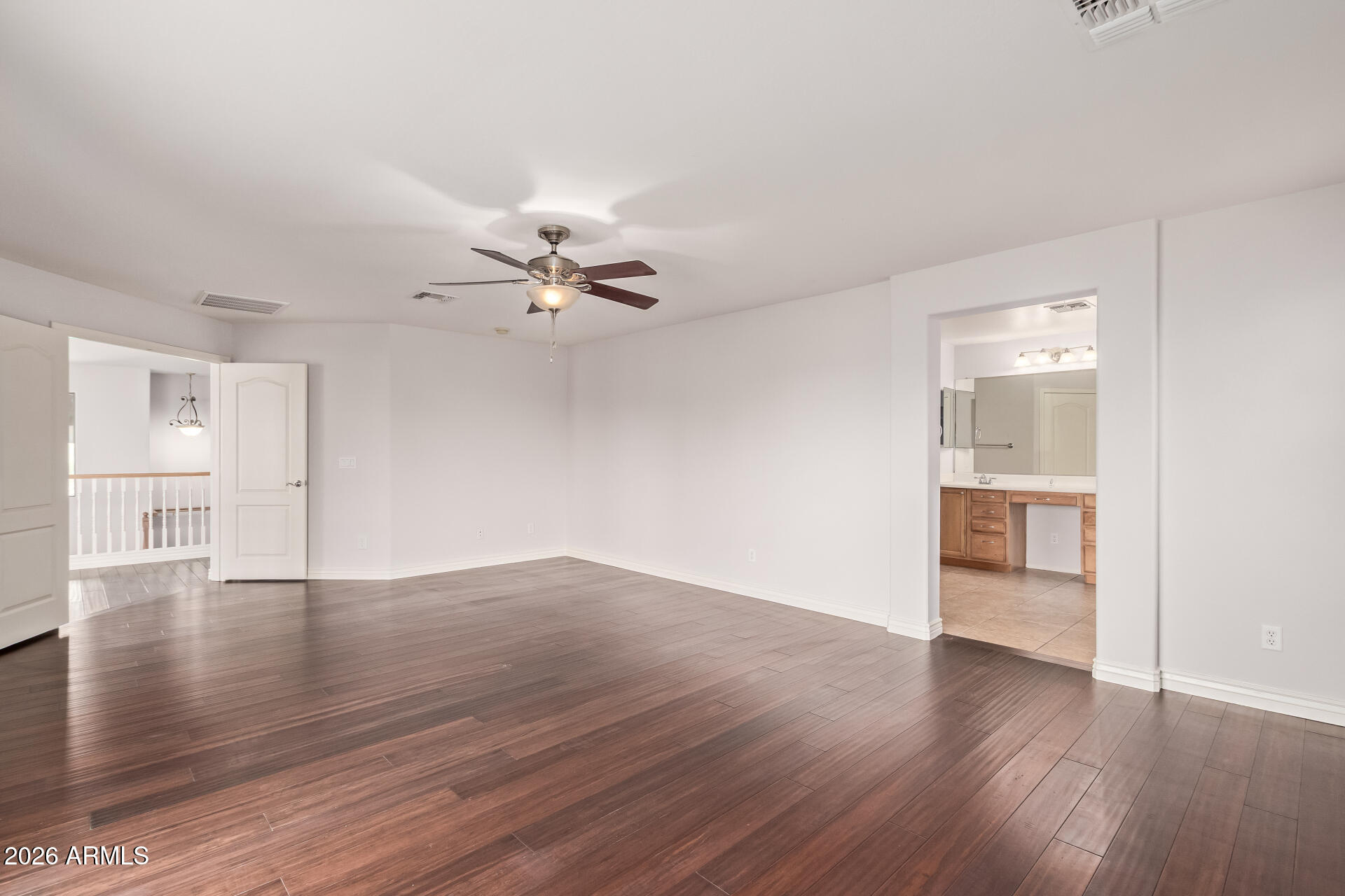 41106 West Coltin Way Maricopa, AZ 85138 - Photo 24 of 51 a view of an empty room with wooden floor