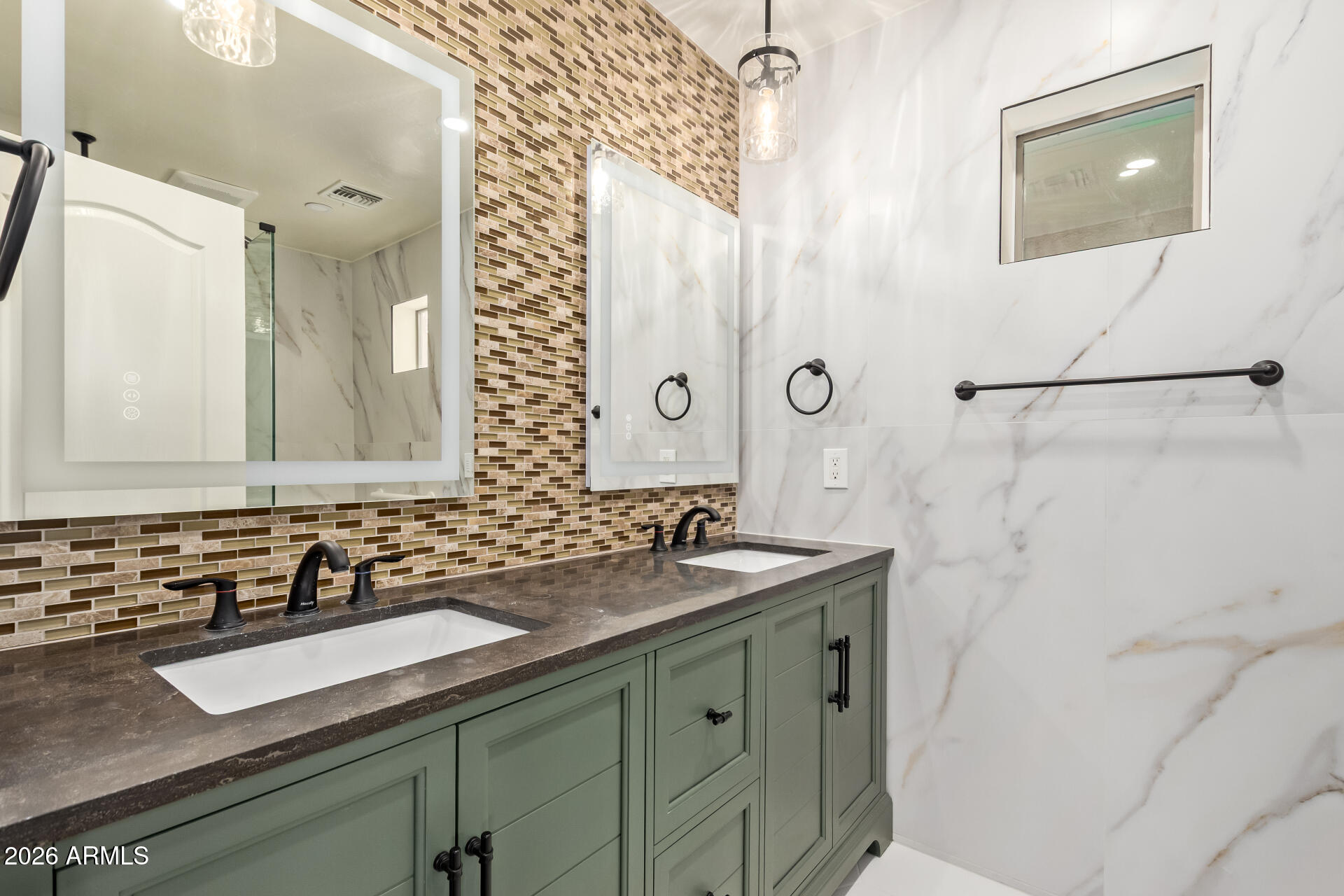 41106 West Coltin Way Maricopa, AZ 85138 - Photo 36 of 51 a bathroom with a sink and a mirror