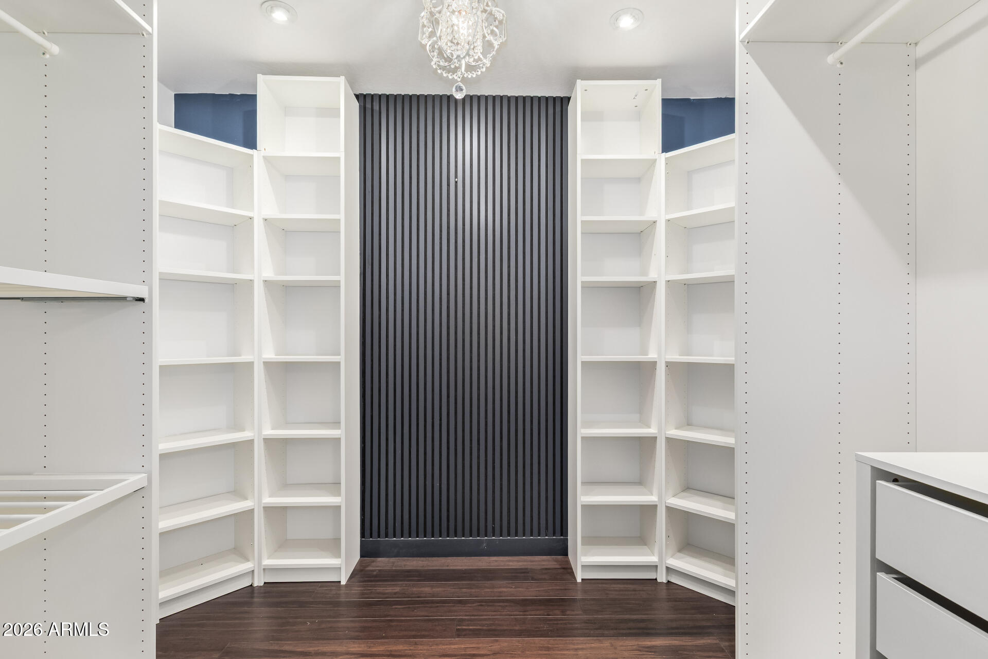 41106 West Coltin Way Maricopa, AZ 85138 - Photo 38 of 51 a view of an empty room with wooden floor and closet