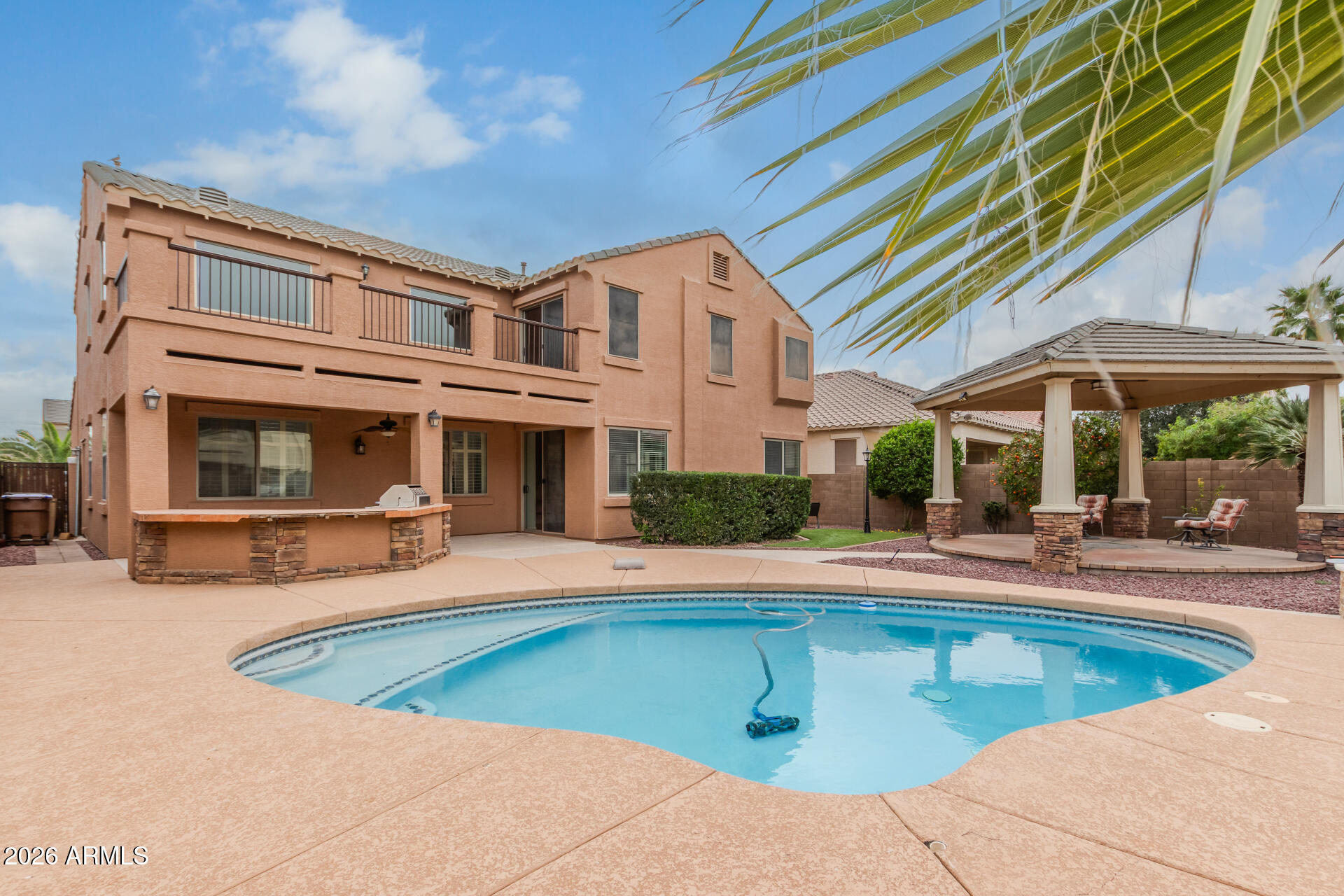 41106 West Coltin Way Maricopa, AZ 85138 - Photo 44 of 51 a view of a house with swimming pool and sitting area
