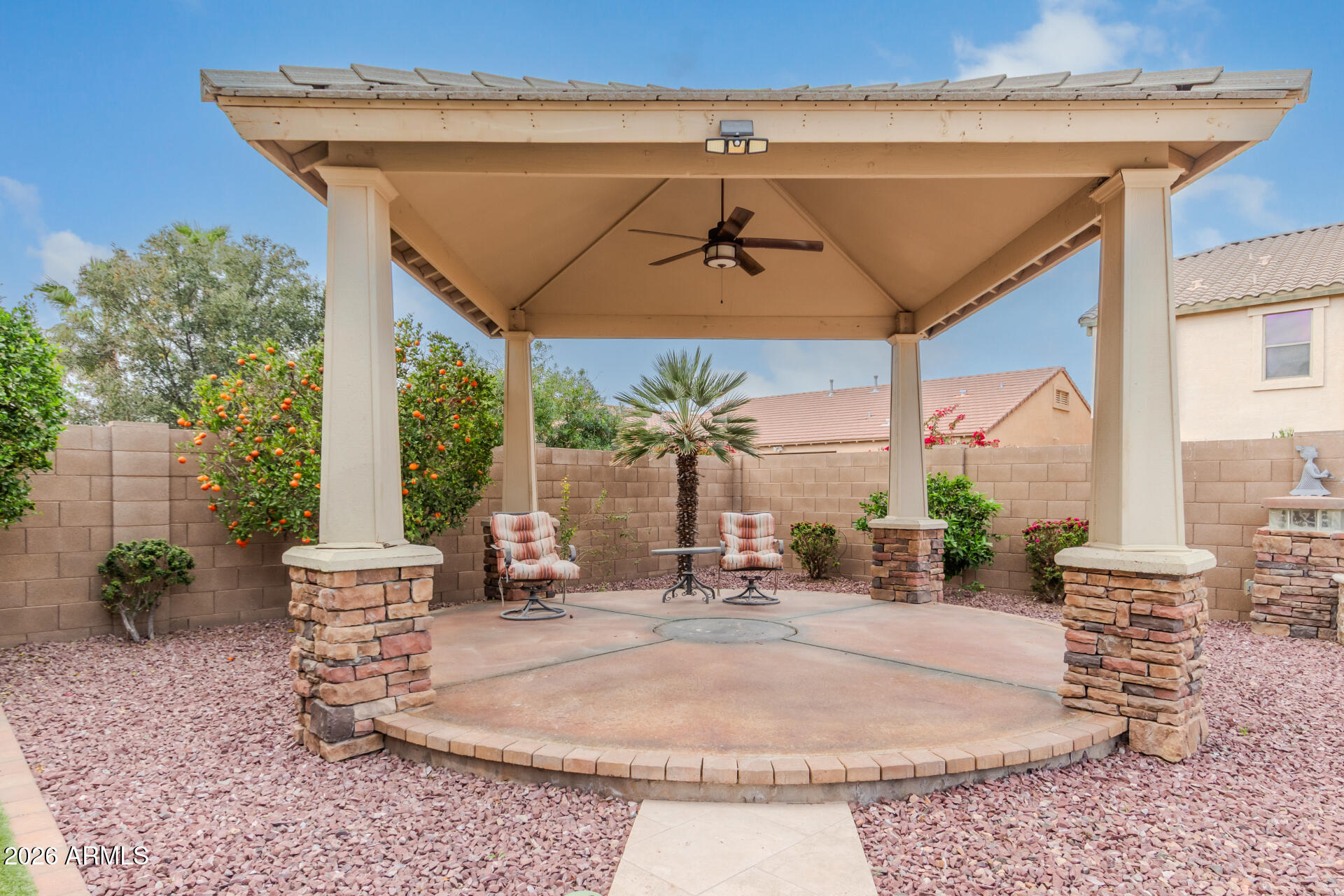 41106 West Coltin Way Maricopa, AZ 85138 - Photo 46 of 51 a view of a patio with a table and chairs