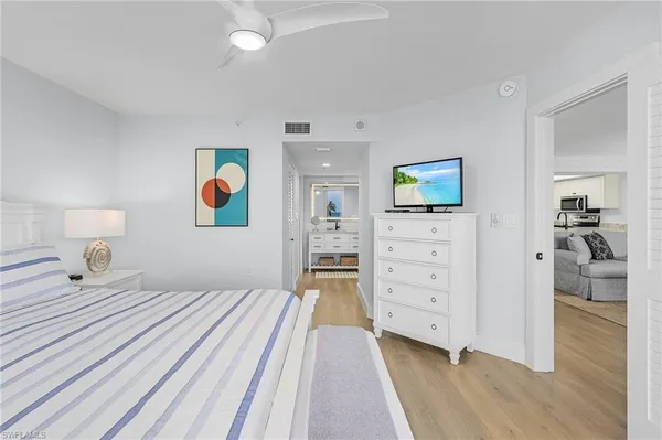 a bedroom with a bed and a view of bedroom