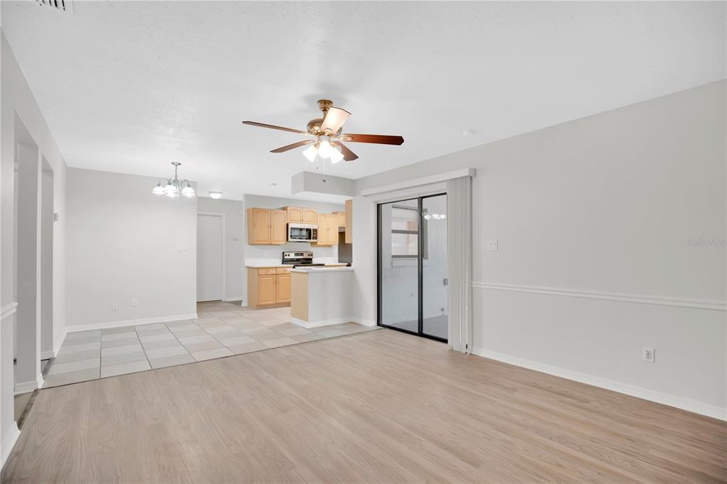 1050 Dishman Loop Oviedo, FL 32765 - Photo 11 of 32 a view of a kitchen with a sink and a refrigerator