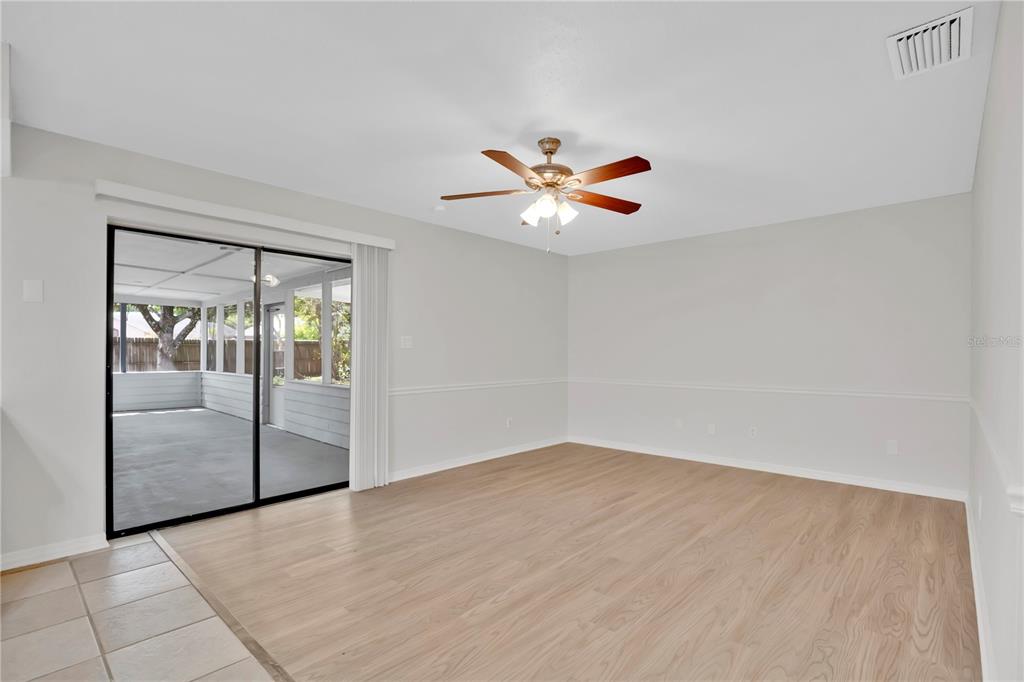 1050 Dishman Loop Oviedo, FL 32765 - Photo 13 of 32 wooden floor in an empty room with a window