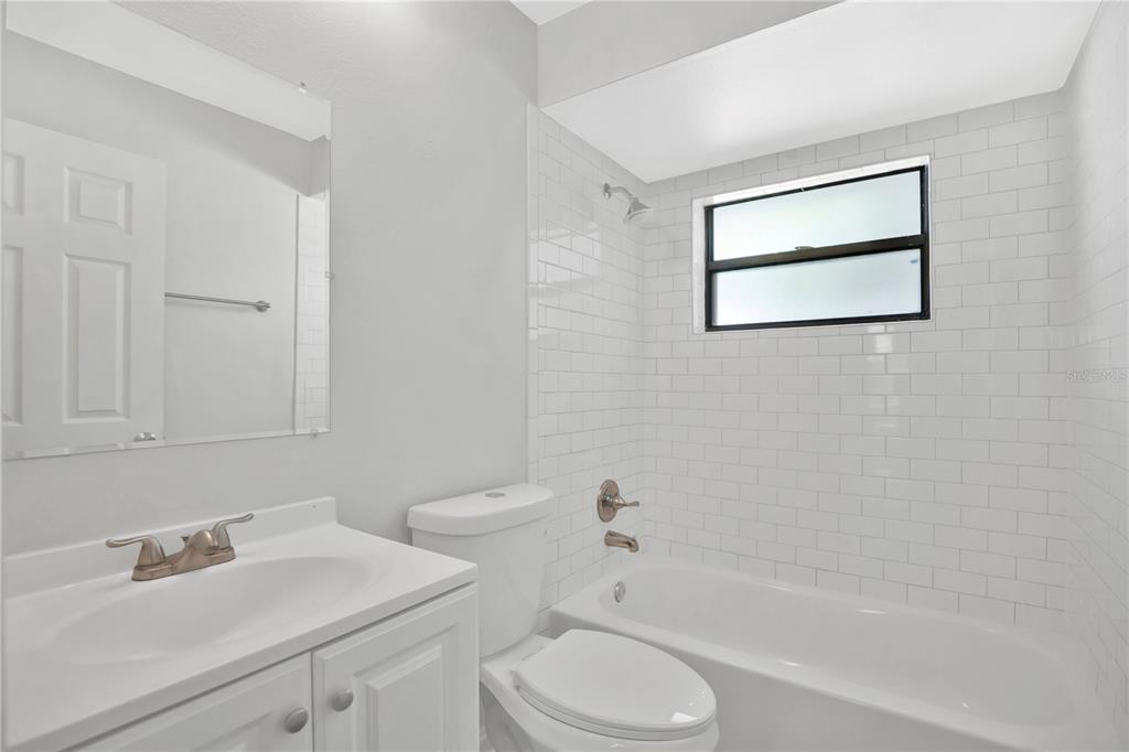 1050 Dishman Loop Oviedo, FL 32765 - Photo 18 of 32 a bathroom with a sink toilet and shower