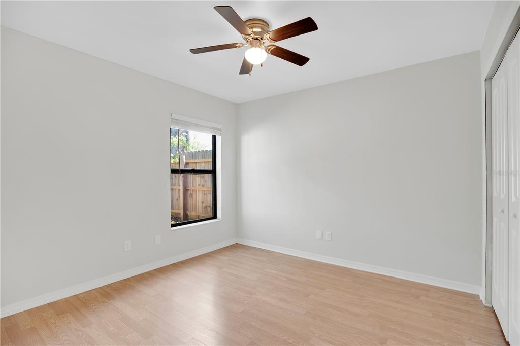 1050 Dishman Loop Oviedo, FL 32765 - Photo 19 of 32 an empty room with window and ceiling fan