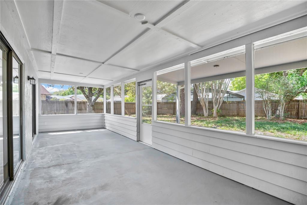 1050 Dishman Loop Oviedo, FL 32765 - Photo 20 of 32 a view of an empty room with wooden floor and a window