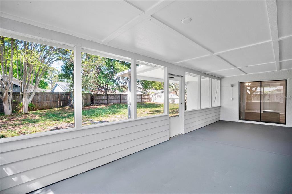 1050 Dishman Loop Oviedo, FL 32765 - Photo 21 of 32 a view of an empty room with wooden floor and a window
