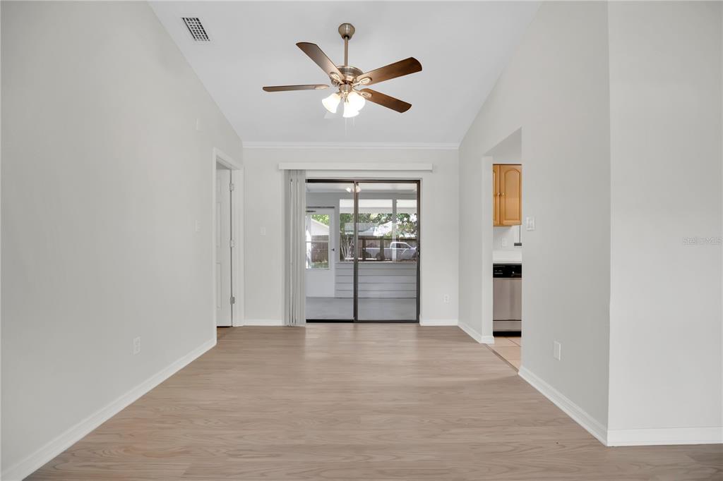 1050 Dishman Loop Oviedo, FL 32765 - Photo 7 of 32 a view of an empty room with a ceiling fan