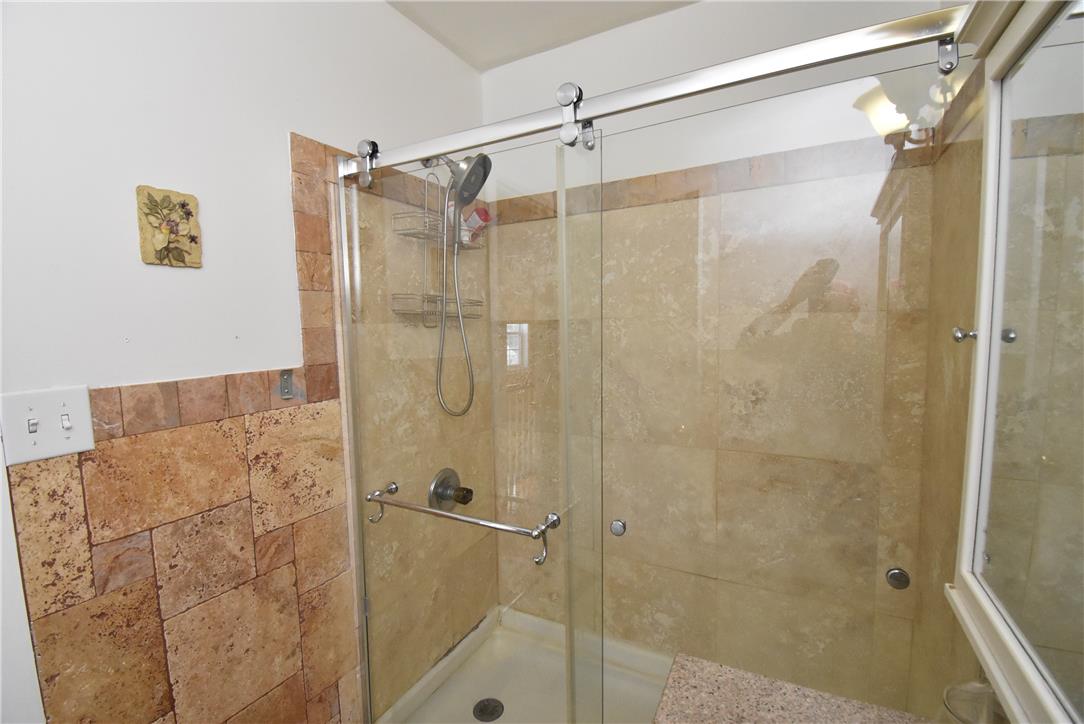 424 Grape Street Whitehall, PA 18052 - Photo 34 of 50 Shower with sliding glass doors and elegant tile accents.