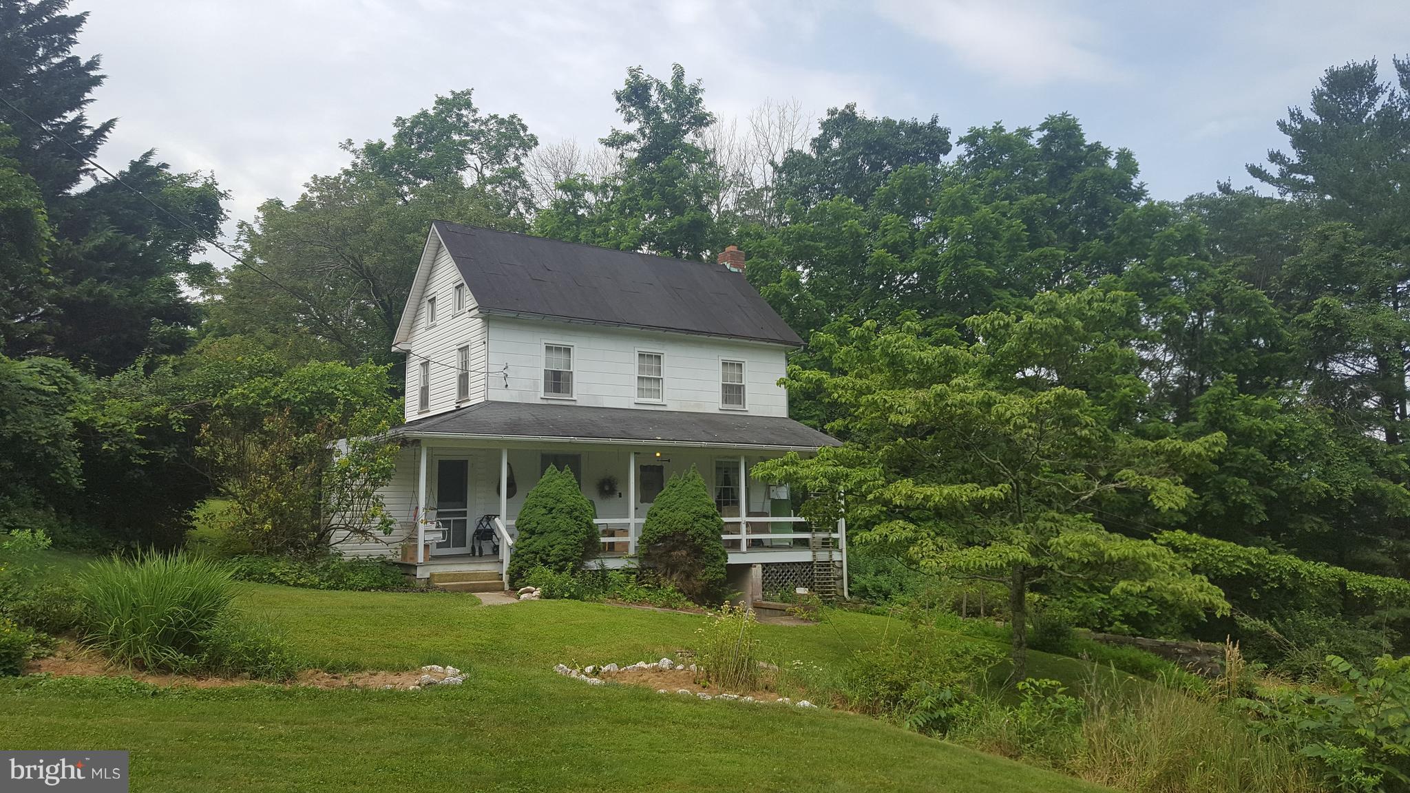 4349 Middlepoint Road Myersville, MD 21773 - Photo 2 of 27 a front view of a house with a yard table and chairs