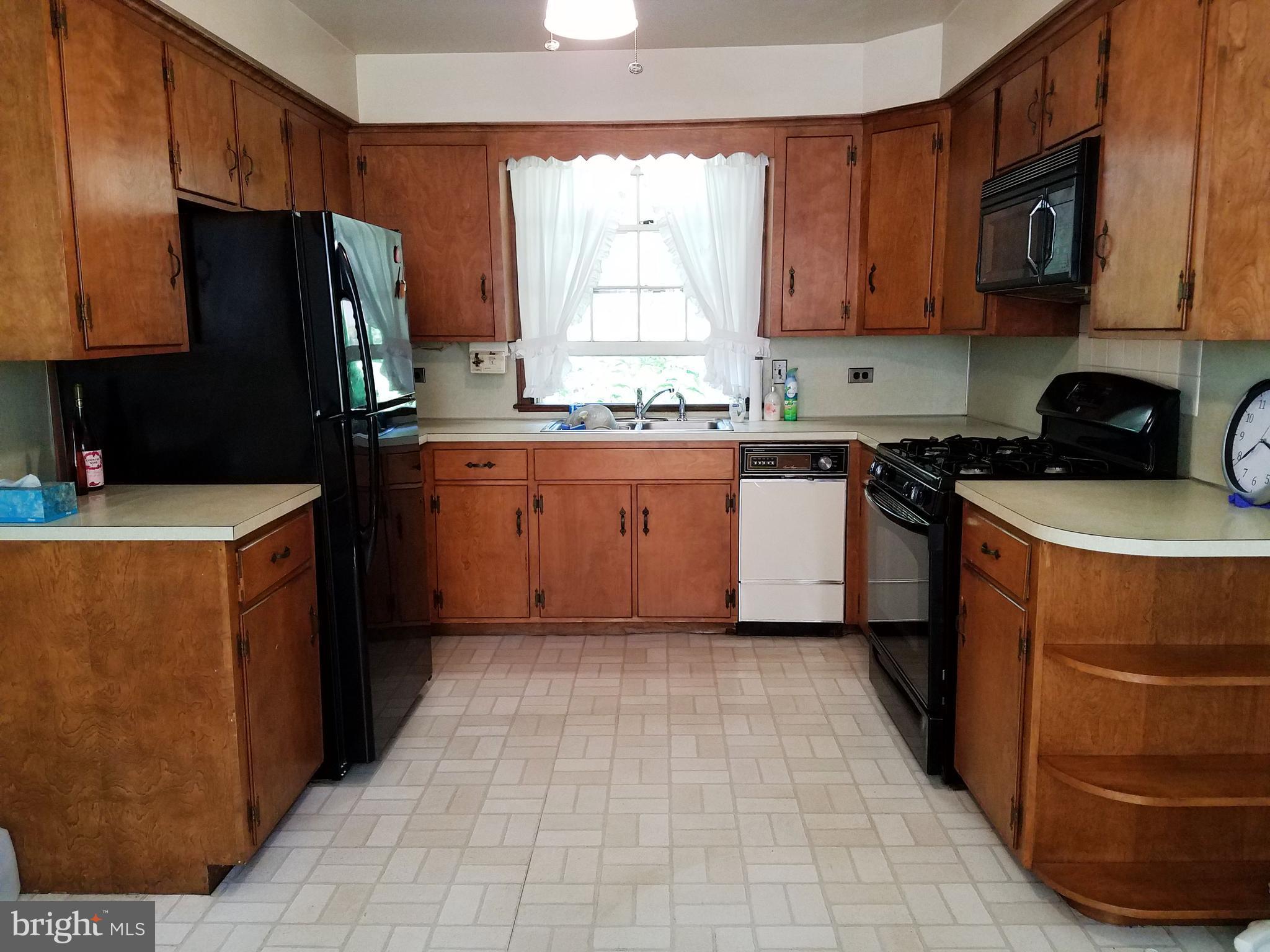 4349 Middlepoint Road Myersville, MD 21773 - Photo 4 of 27 a kitchen with stainless steel appliances a refrigerator sink and microwave