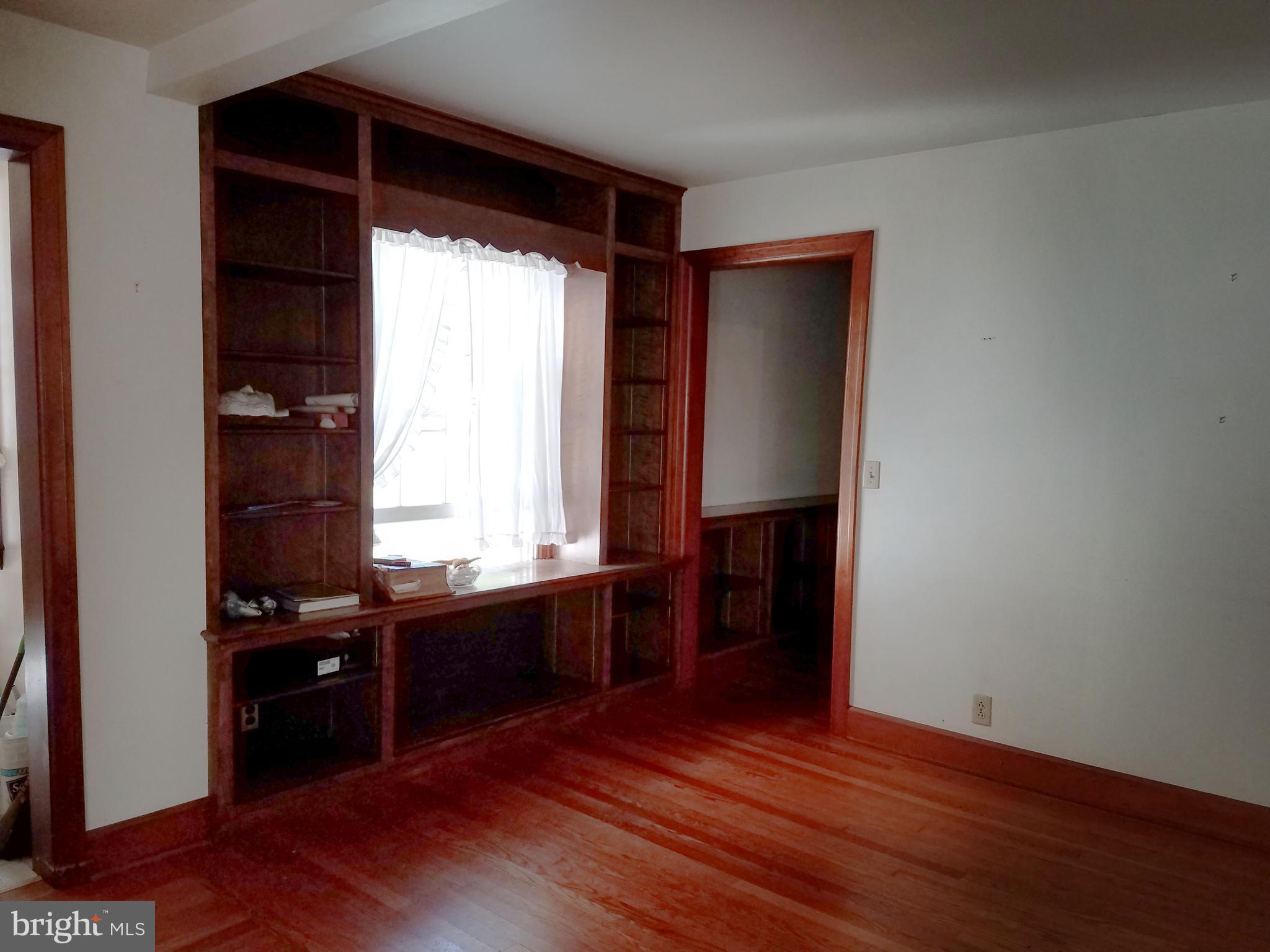 4349 Middlepoint Road Myersville, MD 21773 - Photo 5 of 27 an empty room with wooden floor and windows