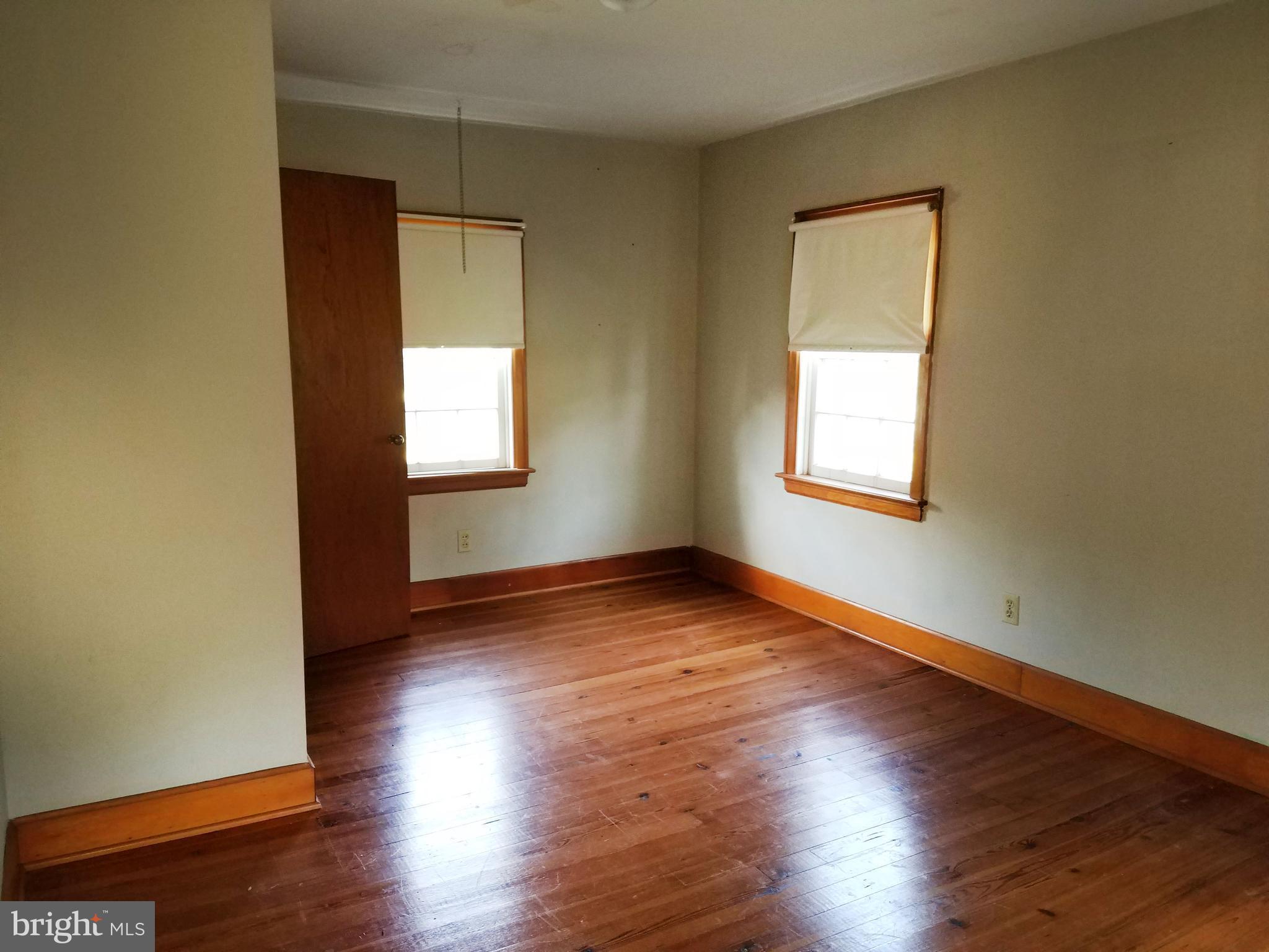 4349 Middlepoint Road Myersville, MD 21773 - Photo 9 of 27 an empty room with wooden floor and windows
