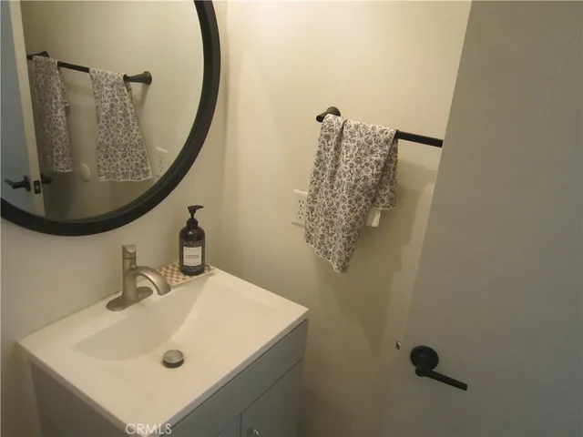a bathroom with a sink and mirror