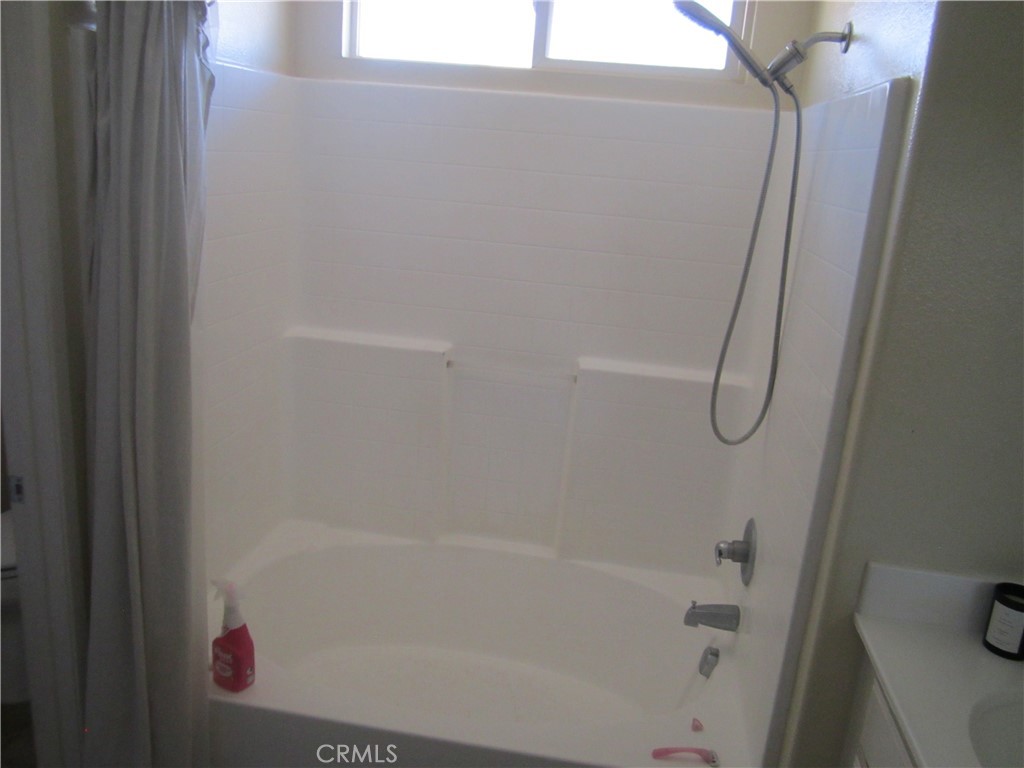 3908 Manquelo Court Perris, CA 92571 - Photo 22 of 36 a close up of a bathtub