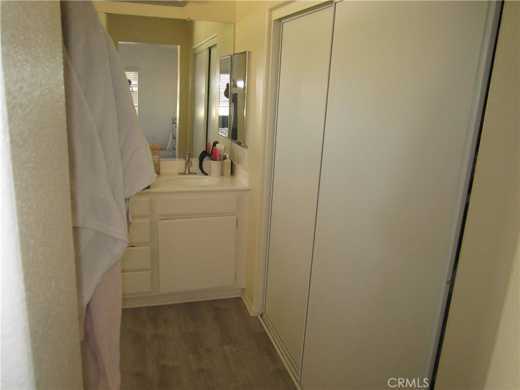 3908 Manquelo Court Perris, CA 92571 - Photo 24 of 36 a bathroom with a sink and mirror