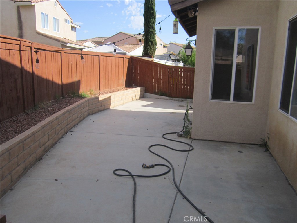 3908 Manquelo Court Perris, CA 92571 - Photo 31 of 36 a view of balcony with furniture