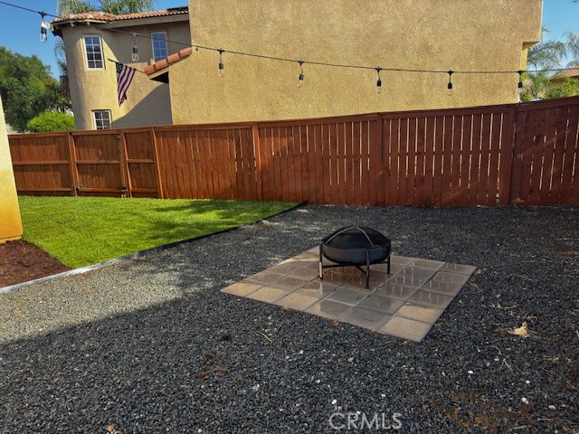 3908 Manquelo Court Perris, CA 92571 - Photo 34 of 36 a backyard of a house with lots of green space