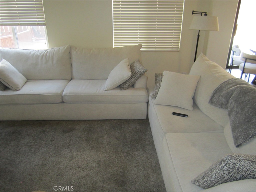 3908 Manquelo Court Perris, CA 92571 - Photo 5 of 36 a living room with furniture and a window