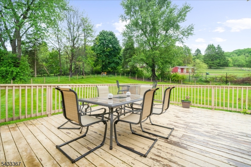 650 Woodglen Road Glen Gardner, NJ 08826 - Photo 18 of 28 a view of a deck with wooden floor and fence