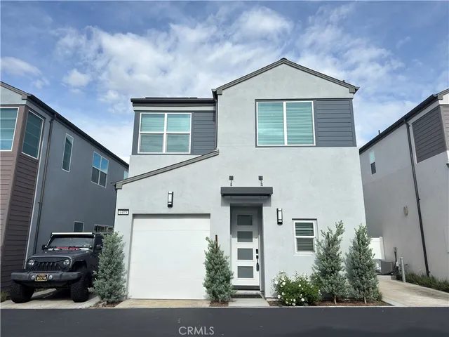 a front view of a house with garage
