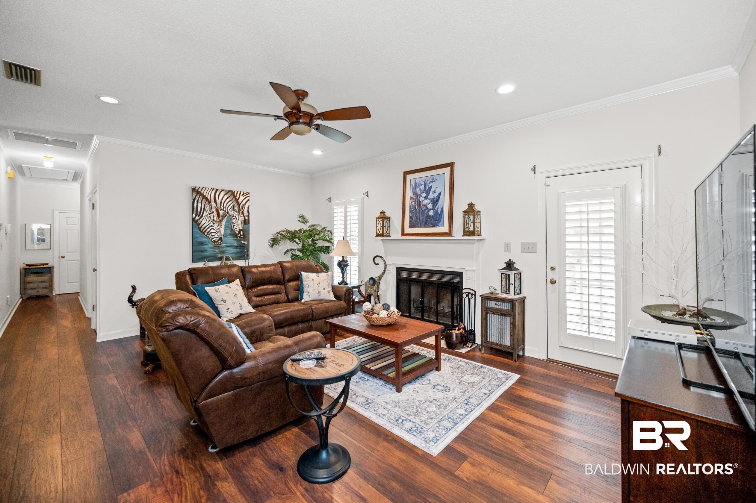 6638 Jackson Square Daphne, AL 36526 - Photo 5 of 62 Living room featuring dark hardwood / wood-style floors, crown molding, and ceiling fan