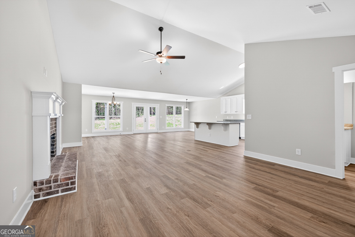 206 Airport Road, Unit 11 Canon, GA 30520 - Photo 6 of 34 an empty room with wooden floor and windows
