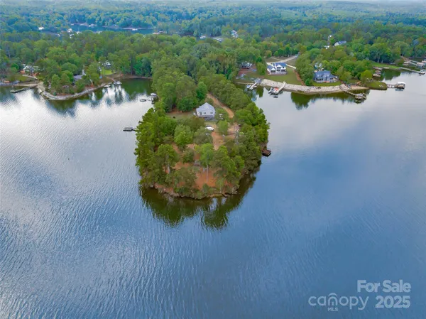 a view of a balcony with mountain view and wooden floor