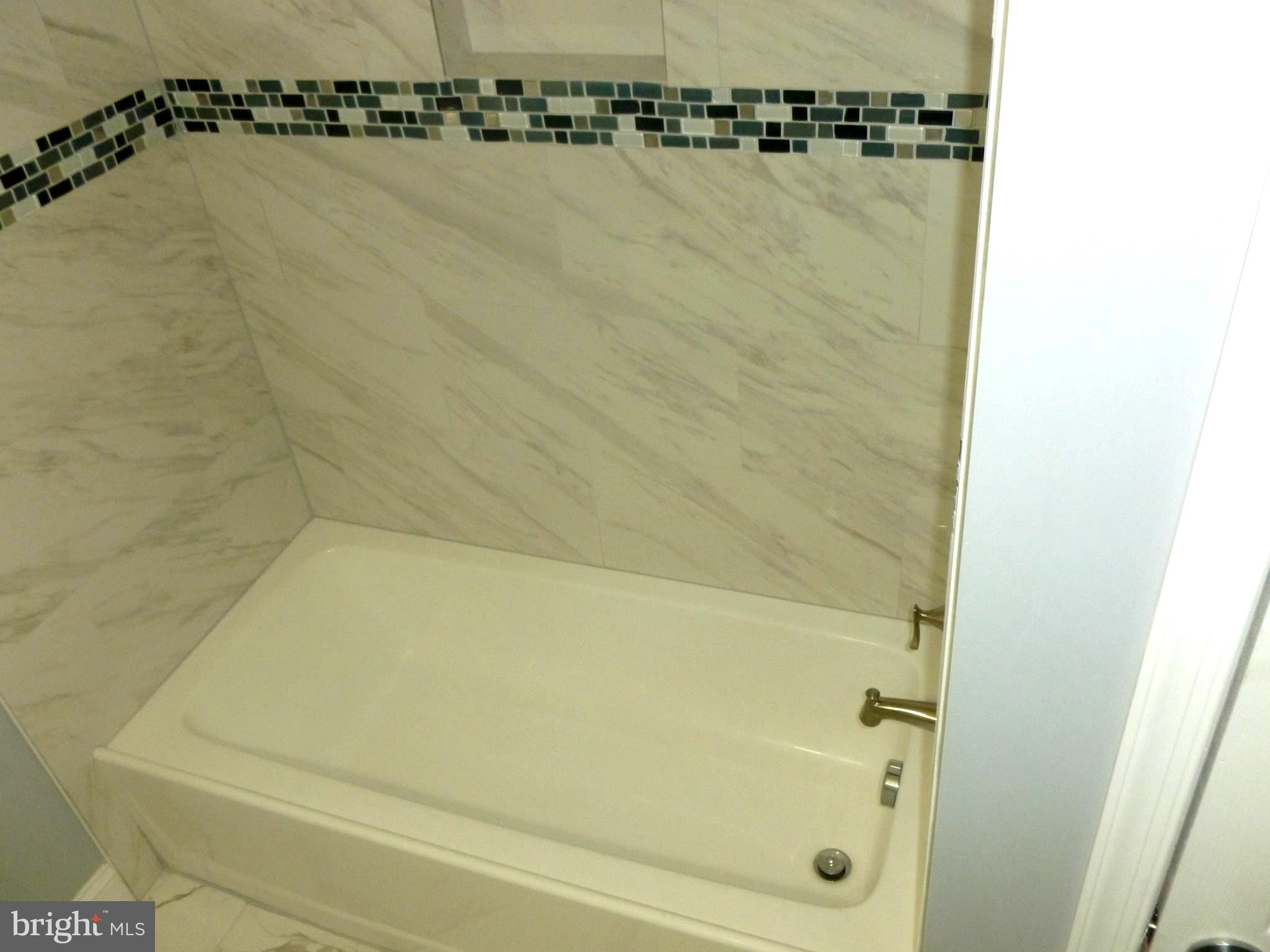 4224 Colborne Road Baltimore, MD 21229 - Photo 30 of 49 Renovated bathroom with new tiles and floor
