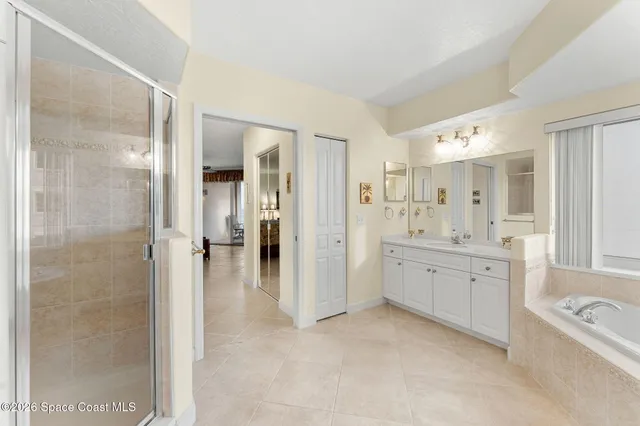 a living room with furniture a rug and a chandelier