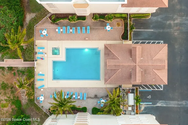 an aerial view of a city with ocean view